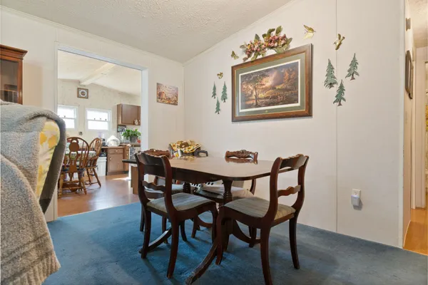 a kitchen with kitchen island a refrigerator stove and microwave