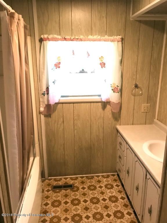 907 Pratt Hollow Road Nicholson, PA 18446 - Photo 22 of 33 a bathroom with a sink and a shower