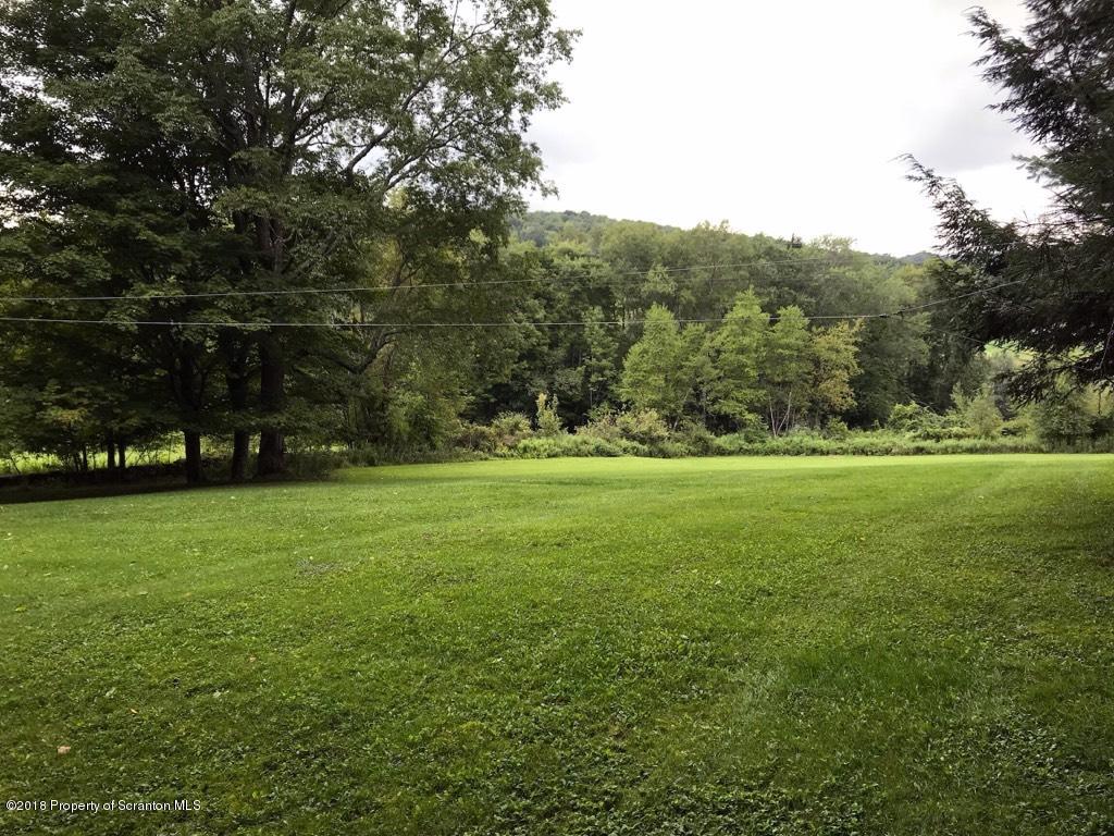 907 Pratt Hollow Road Nicholson, PA 18446 - Photo 7 of 33 a view of outdoor space with deck and yard