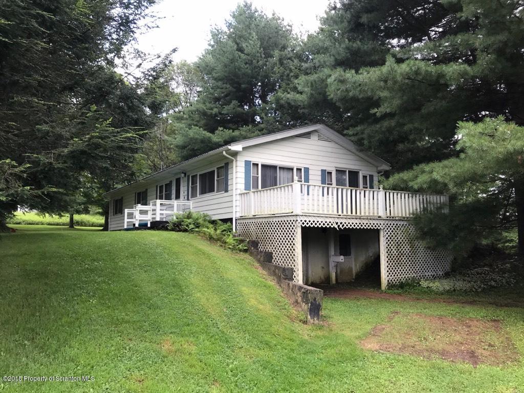 907 Pratt Hollow Road Nicholson, PA 18446 - Photo 10 of 33 a front view of a house with a garden