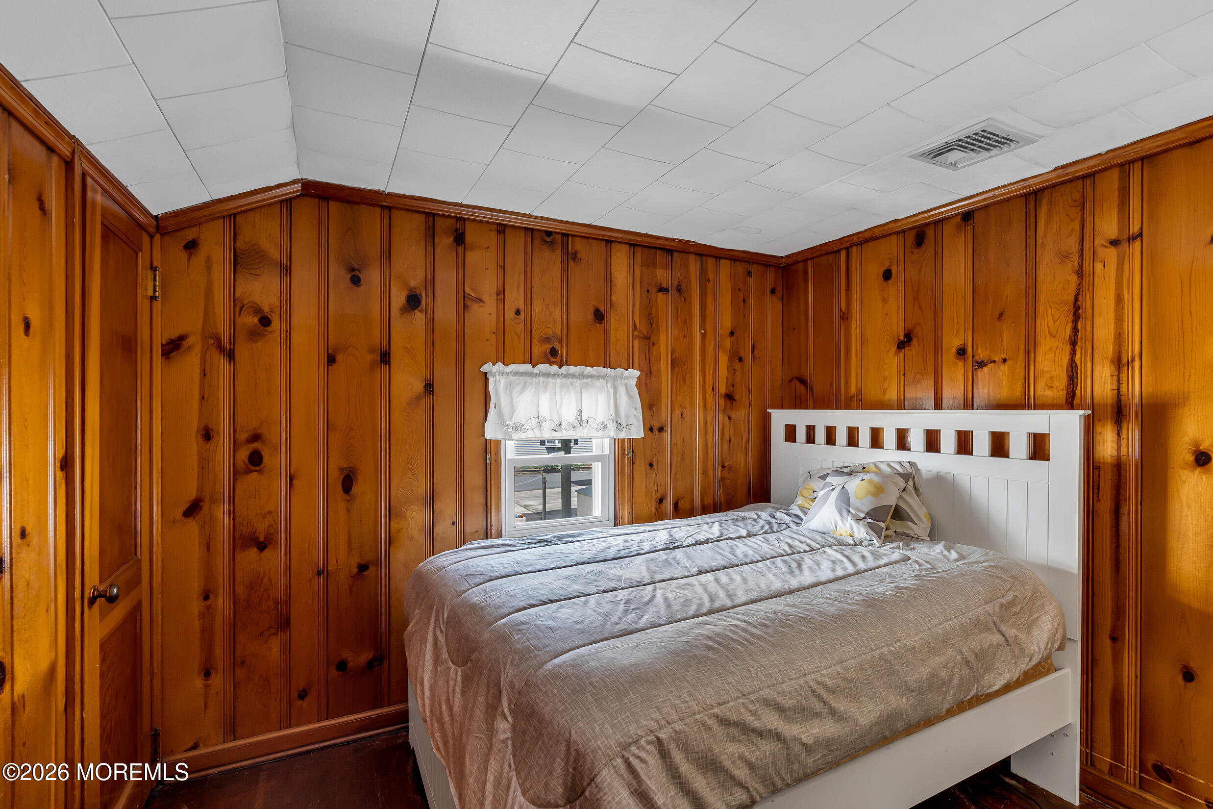 21 East Bay Way Lavallette, NJ 08735 - Photo 11 of 23 a bedroom with a bed and a dresser