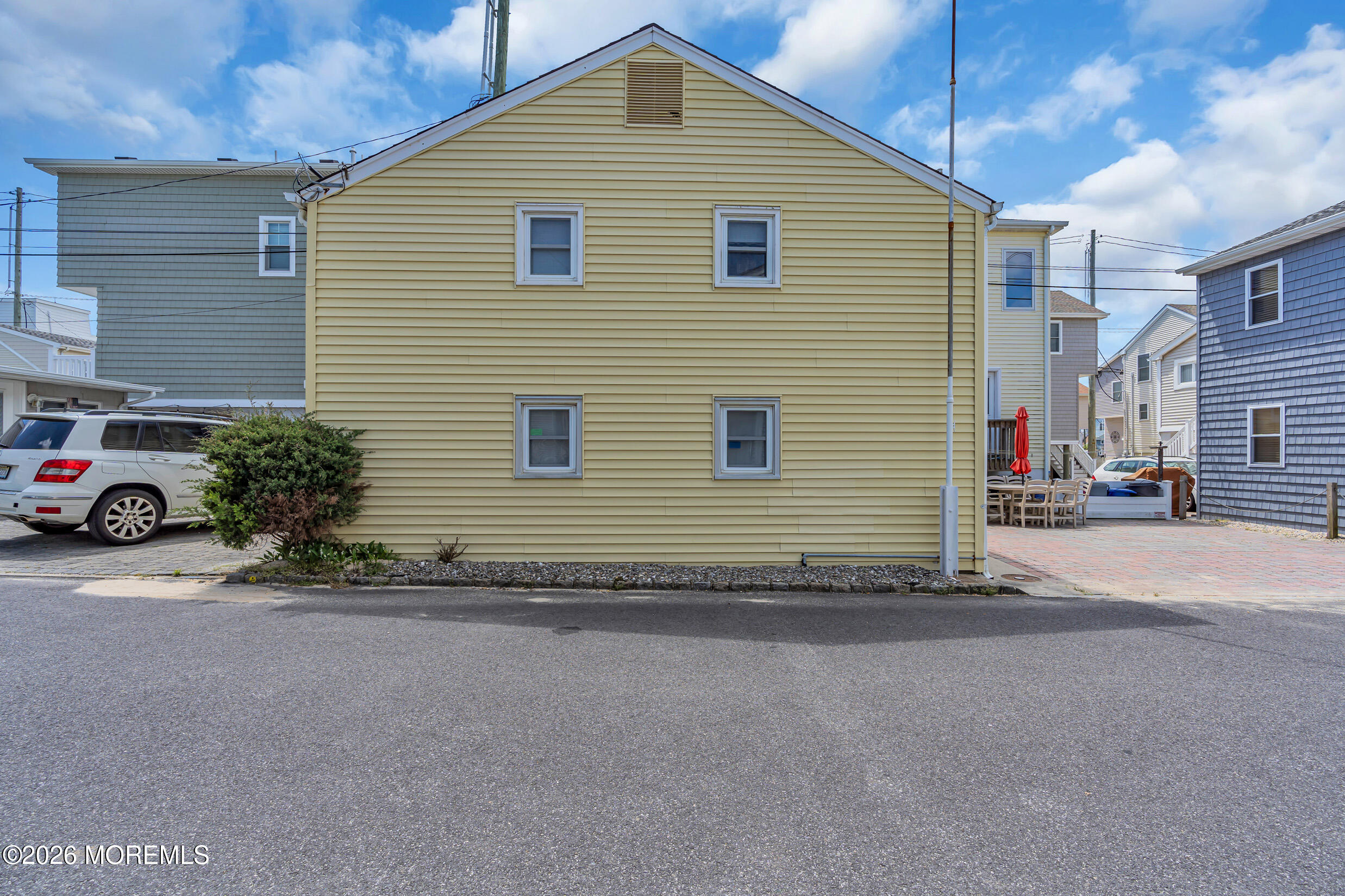 21 East Bay Way Lavallette, NJ 08735 - Photo 19 of 23 a front view of a house with a garage