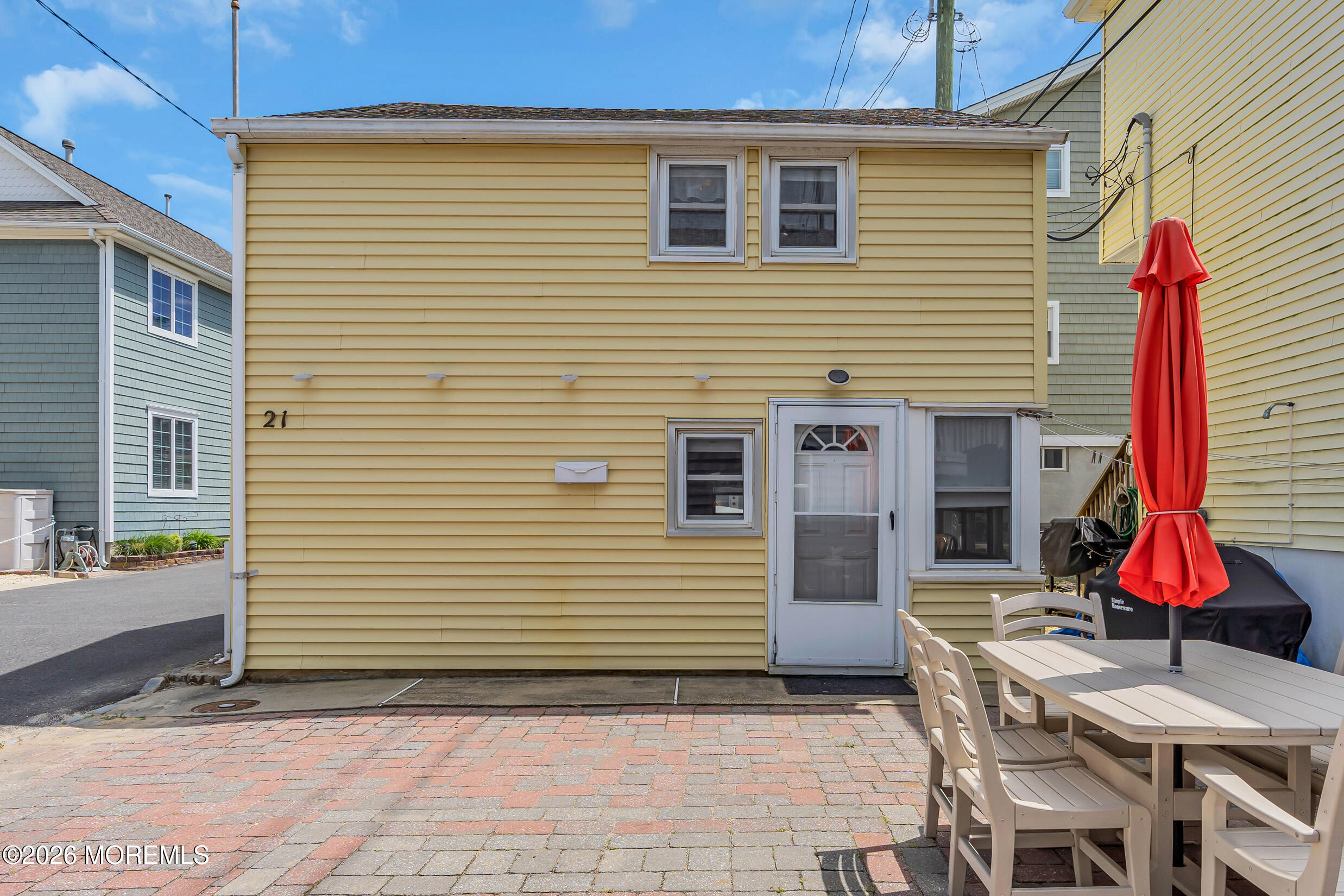 21 East Bay Way Lavallette, NJ 08735 - Photo 21 of 23 a view of a house with a patio