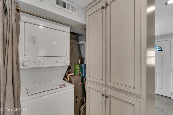 a view of storage and utility room with washer and dryer