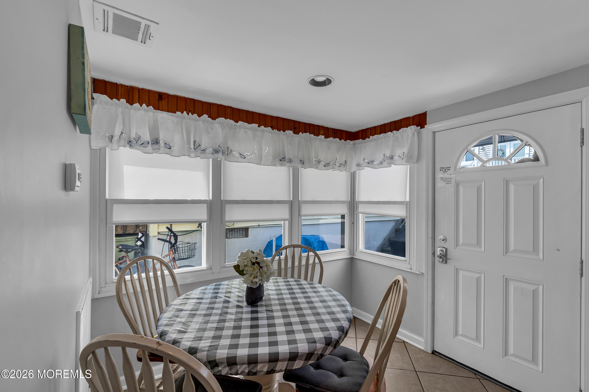 21 East Bay Way Lavallette, NJ 08735 - Photo 10 of 23 a view of a dining room with furniture window and outside view