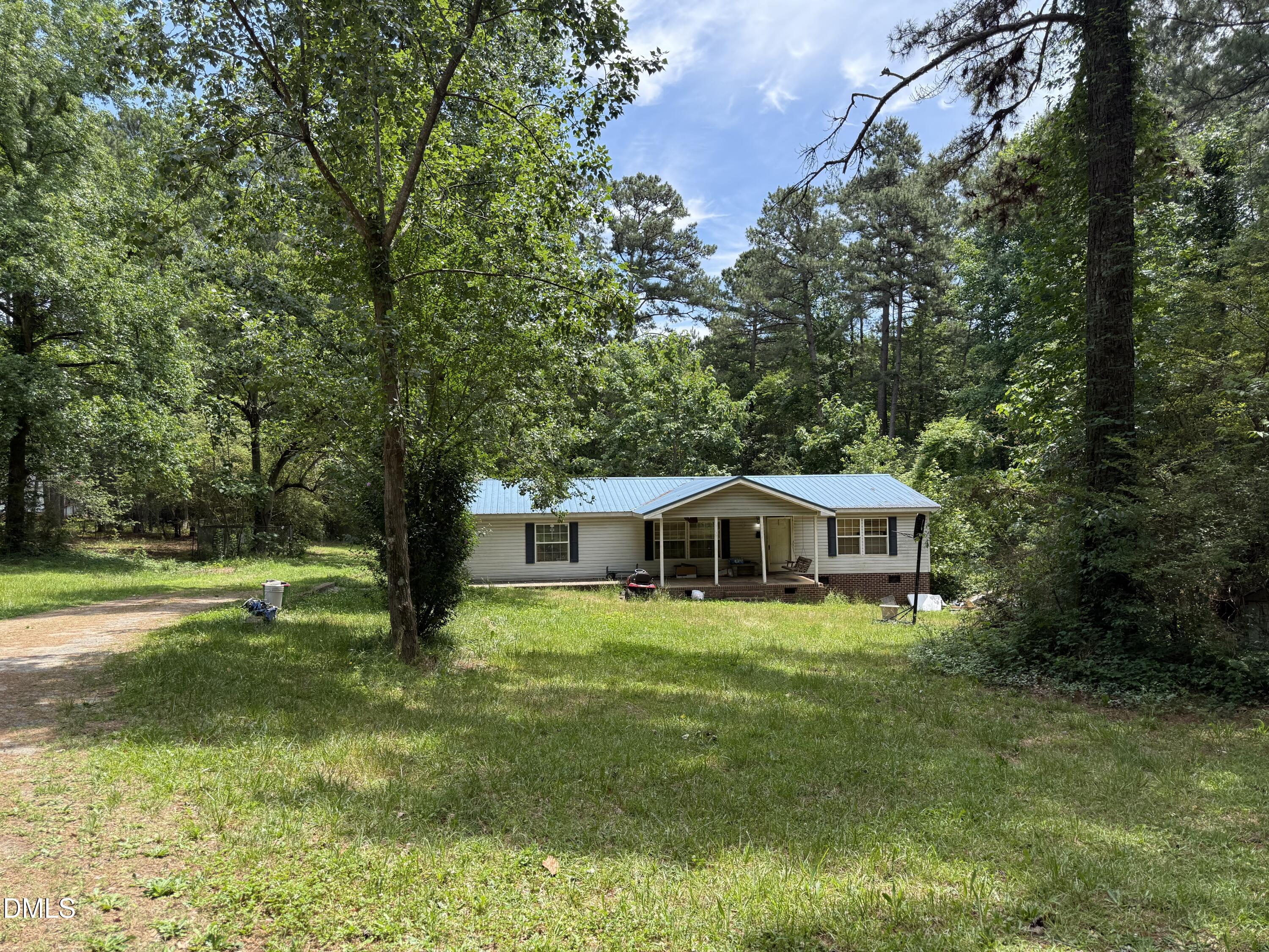 4749 Buckhorn Road Sanford, NC 27330 - Photo 1 of 18 a house view with swimming pool and garden space