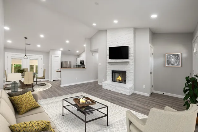 a living room with furniture and a fireplace