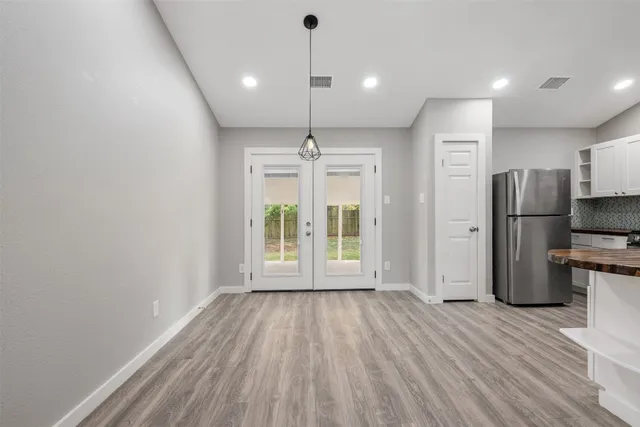 a view of kitchen with stainless steel appliances refrigerator oven microwave and stove
