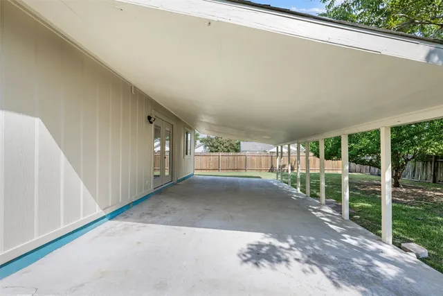 a view of large trees with backyard