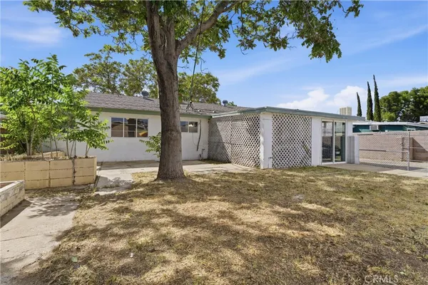 a house with a tree in front of it