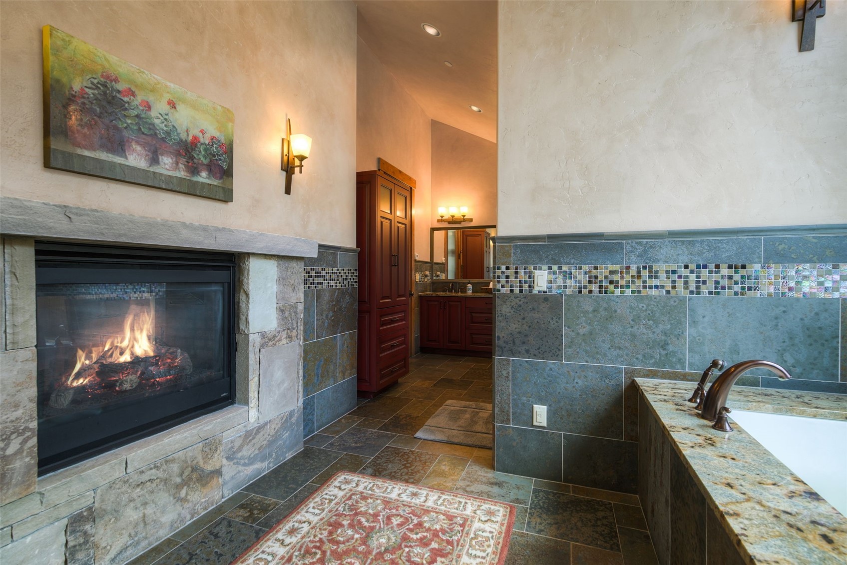 560 Beeler Place Frisco, CO 80443 - Photo 20 of 40 a bathroom with a sink and a fireplace
