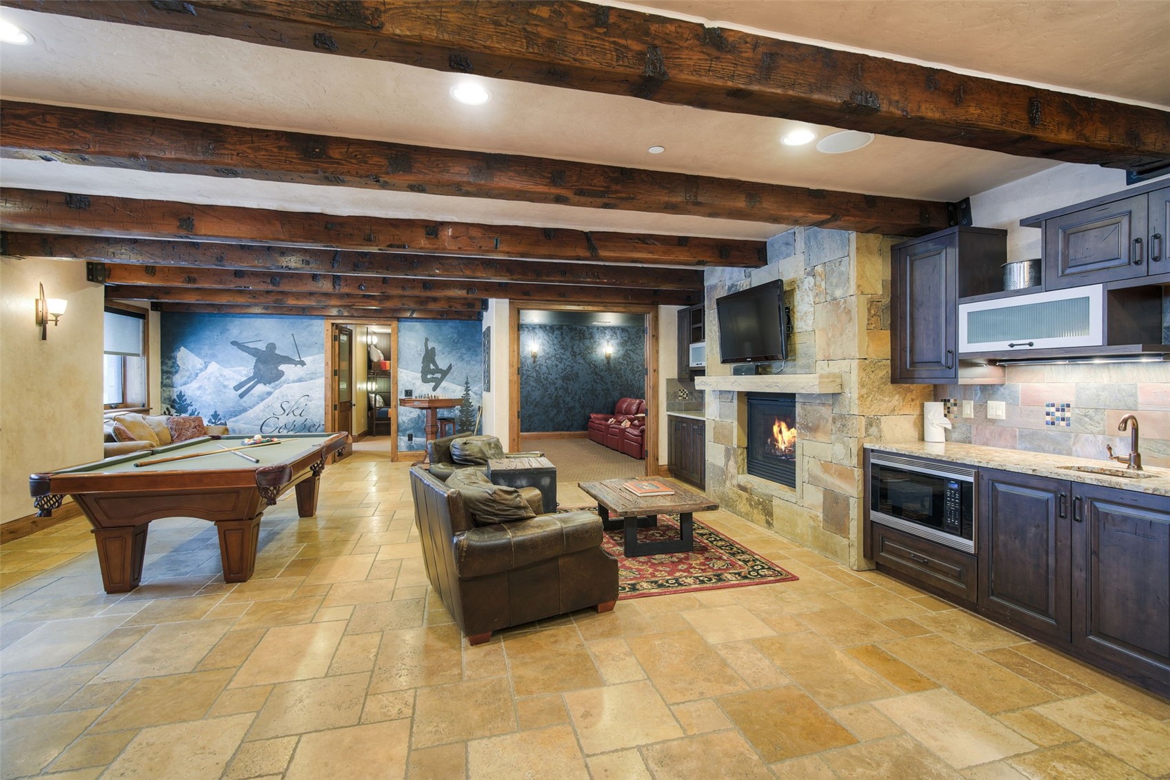 560 Beeler Place Frisco, CO 80443 - Photo 26 of 40 a large kitchen with stainless steel appliances and furniture