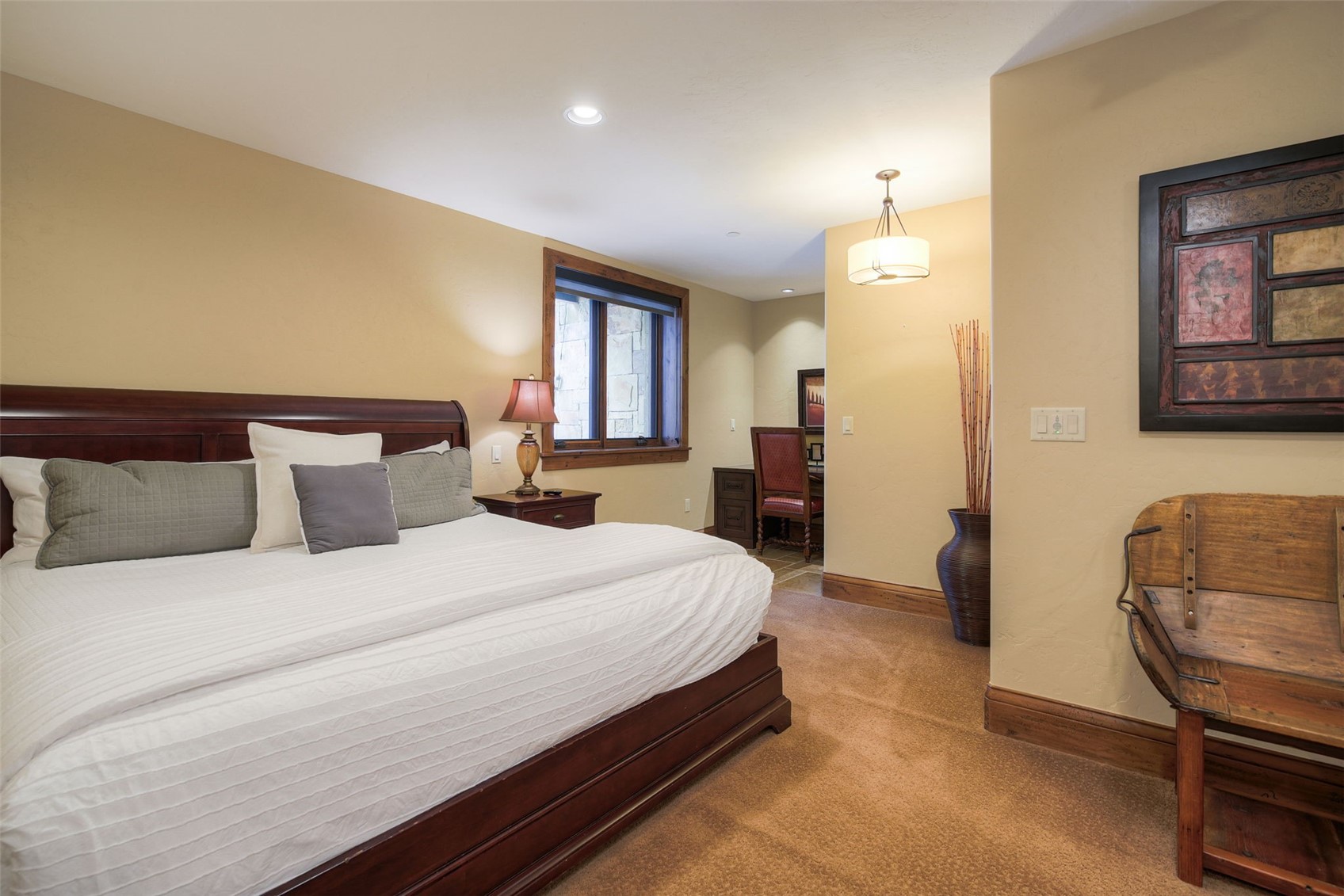 560 Beeler Place Frisco, CO 80443 - Photo 31 of 40 a spacious bedroom with a bed and dresser