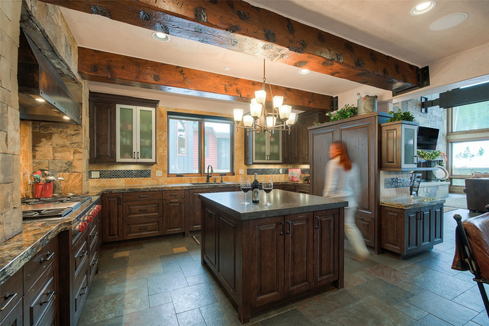 560 Beeler Place Frisco, CO 80443 - Photo 8 of 40 a kitchen with stainless steel appliances granite countertop a sink and a stove