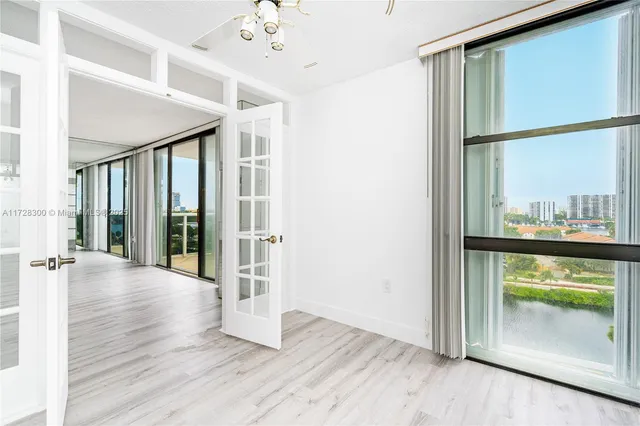 a view of an entryway with wooden floor