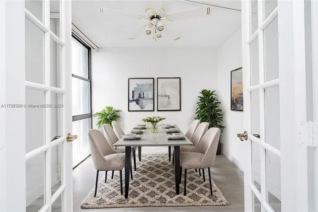 a view of a dining room with furniture window and wooden floor