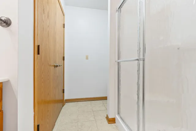 a view of a room with wooden floor