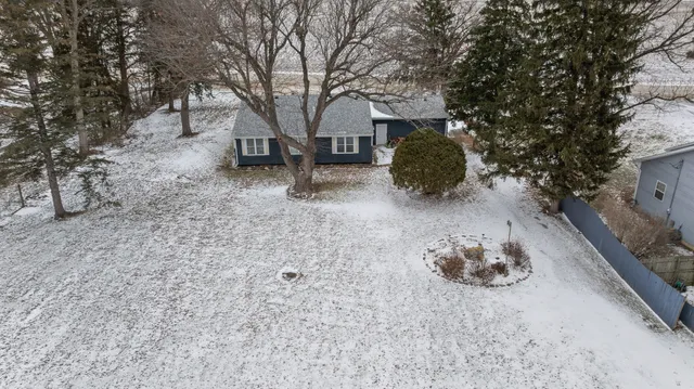 a view of a covered with snow in the yard