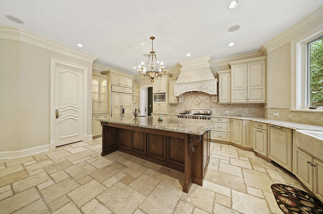 9600 Pacific Court Burr Ridge, IL 60527 - Photo 11 of 58 a large kitchen with kitchen island a sink stainless steel appliances and cabinets