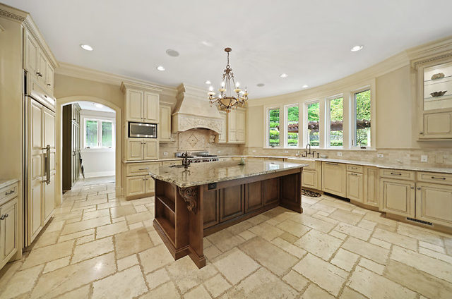 9600 Pacific Court Burr Ridge, IL 60527 - Photo 12 of 58 a large kitchen with kitchen island granite countertop a large counter top and stainless steel appliances