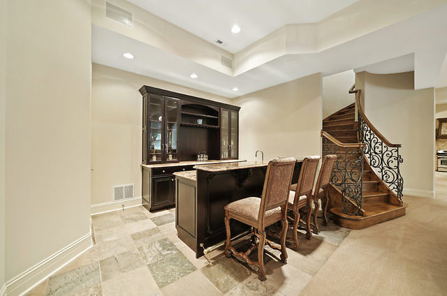 9600 Pacific Court Burr Ridge, IL 60527 - Photo 21 of 58 a living room with a couch and a dining table with wooden floor
