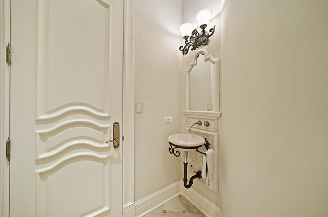 9600 Pacific Court Burr Ridge, IL 60527 - Photo 29 of 58 a bathroom with a sink a mirror and a shower