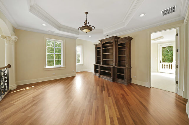 9600 Pacific Court Burr Ridge, IL 60527 - Photo 38 of 58 a view of a livingroom with wooden floor and windows