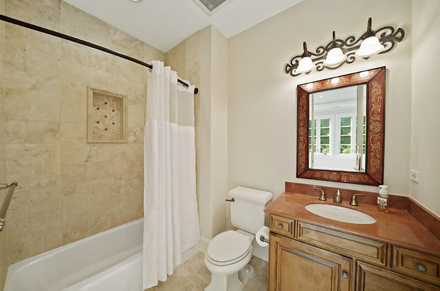9600 Pacific Court Burr Ridge, IL 60527 - Photo 40 of 58 a bathroom with a granite countertop sink toilet and shower