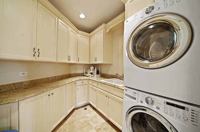 9600 Pacific Court Burr Ridge, IL 60527 - Photo 41 of 58 a utility room with sink dryer and washer