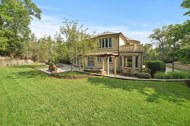9600 Pacific Court Burr Ridge, IL 60527 - Photo 53 of 58 a view of a house with a yard table and chairs