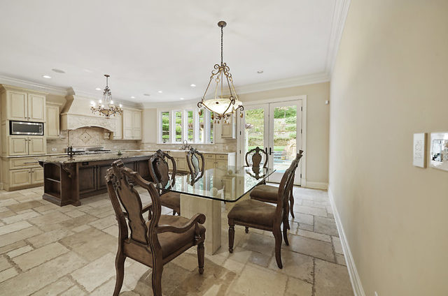 9600 Pacific Court Burr Ridge, IL 60527 - Photo 10 of 58 a view of a dining room with furniture and chandelier