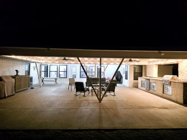 a view of living room with furniture and floor to ceiling window