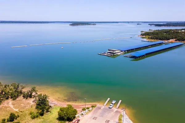 a view of a lake with wooden floor
