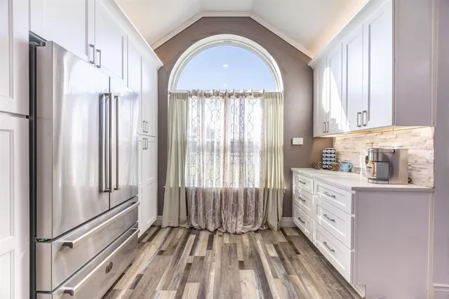 a kitchen with stainless steel appliances kitchen island granite countertop lots of counter top space and furniture