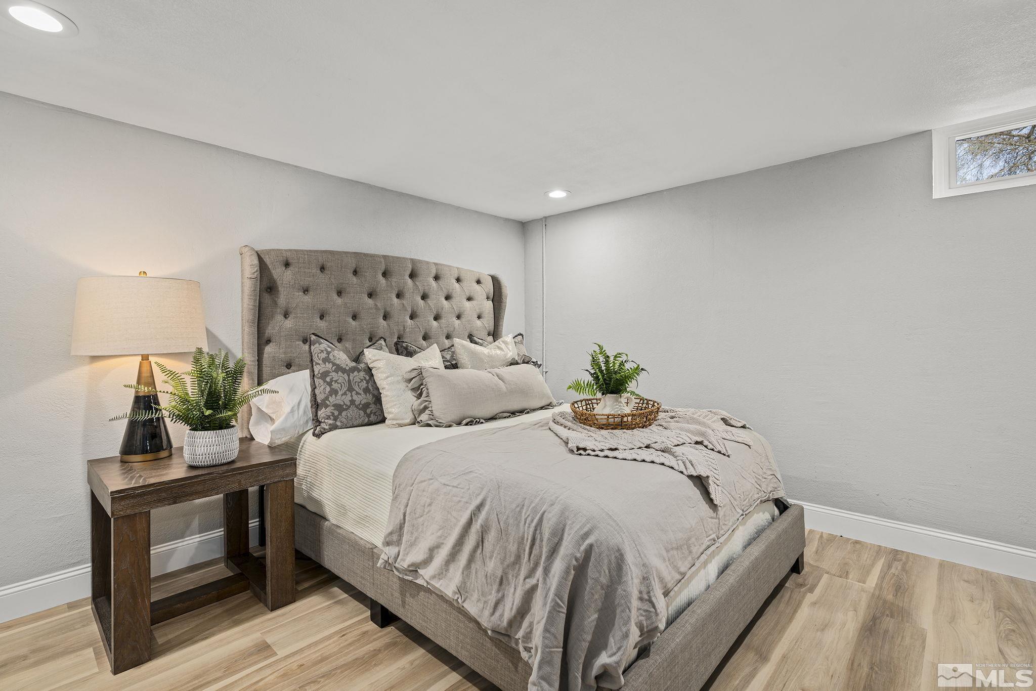 765 Wilkinson Avenue Reno, NV 89502 - Photo 22 of 29 a bedroom with a bed and a lamp
