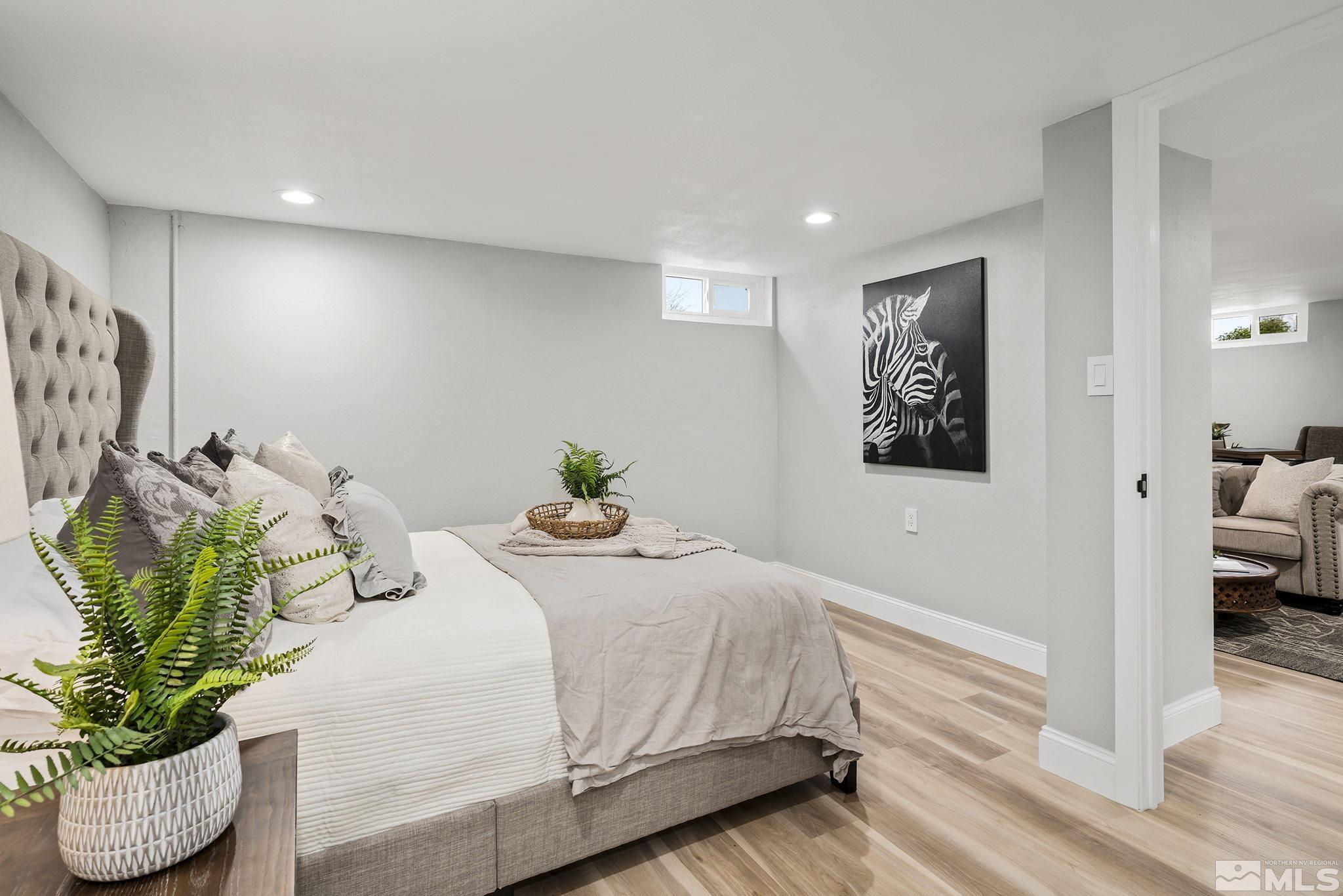 765 Wilkinson Avenue Reno, NV 89502 - Photo 23 of 29 a bedroom with a bed and a potted plant