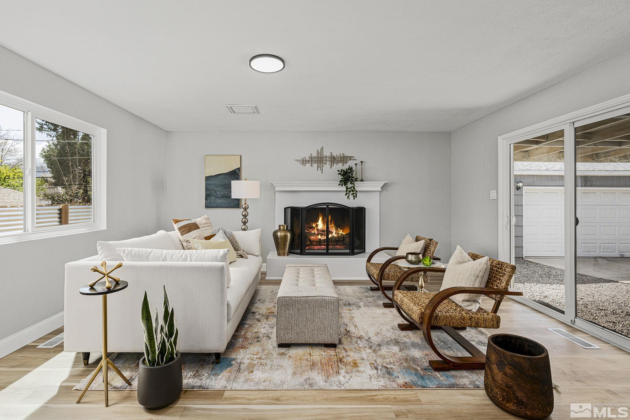 765 Wilkinson Avenue Reno, NV 89502 - Photo 7 of 29 a living room with furniture and a fireplace