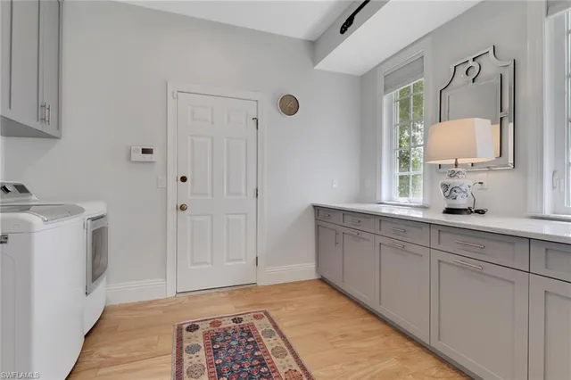 a bathroom with double vanity sink and mirror