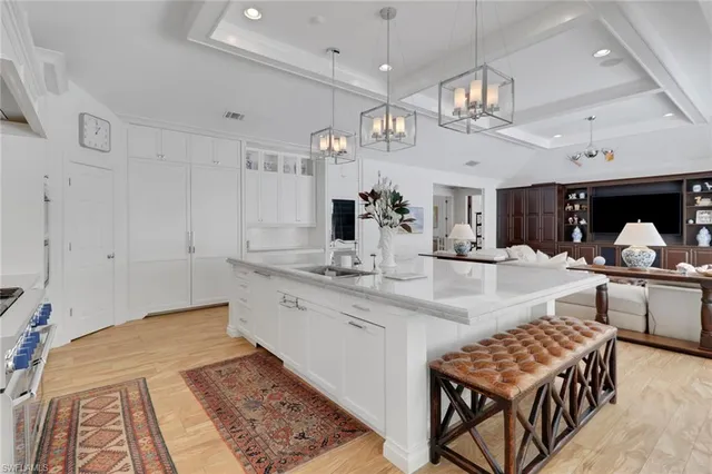 a large kitchen with a table and chairs in it