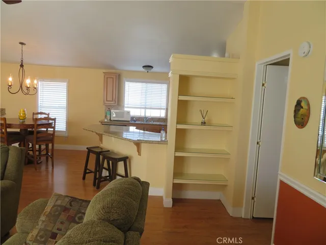 a living room with furniture a dining table and chairs