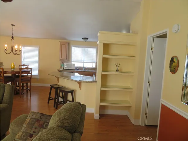 a large bed sitting in a bedroom next to a window