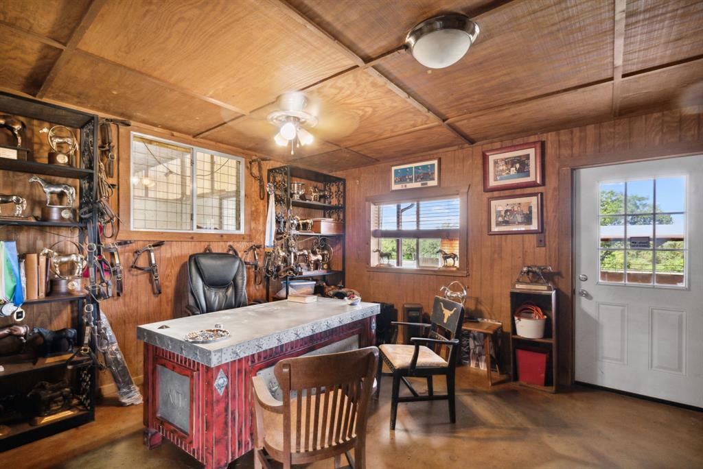 2710 Advance Road Poolville, TX 76487 - Photo 32 of 40 a view of a livingroom with furniture window and wooden floor