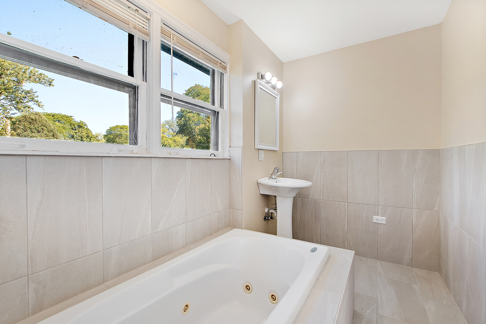 1718 West 187th Street Homewood, IL 60430 - Photo 15 of 28 a bathroom with a bathtub and window
