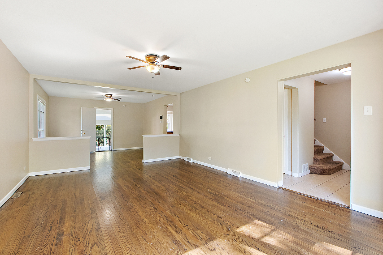 1718 West 187th Street Homewood, IL 60430 - Photo 4 of 28 a view of a room with wooden floor and a ceiling fan