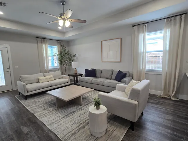 a living room with furniture and a window