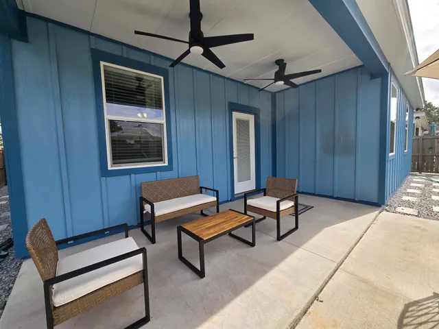 a outdoor living space with furniture and a window