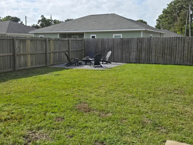 a view of a back yard of the house