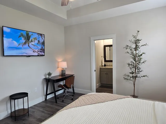 a bedroom with a bed and a table in it