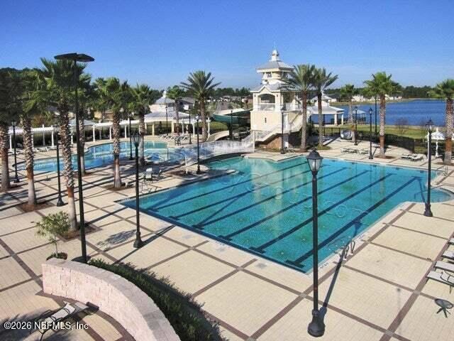 14454 Millhopper Road Jacksonville, FL 32258 - Photo 43 of 44 a view of a swimming pool with outdoor seating