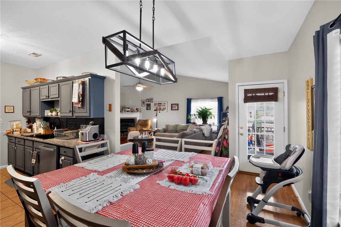 144 Elliott Circle Anderson, SC 29621 - Photo 7 of 30 A welcoming dining area features hardwood floors and seamless access to outdoor living.